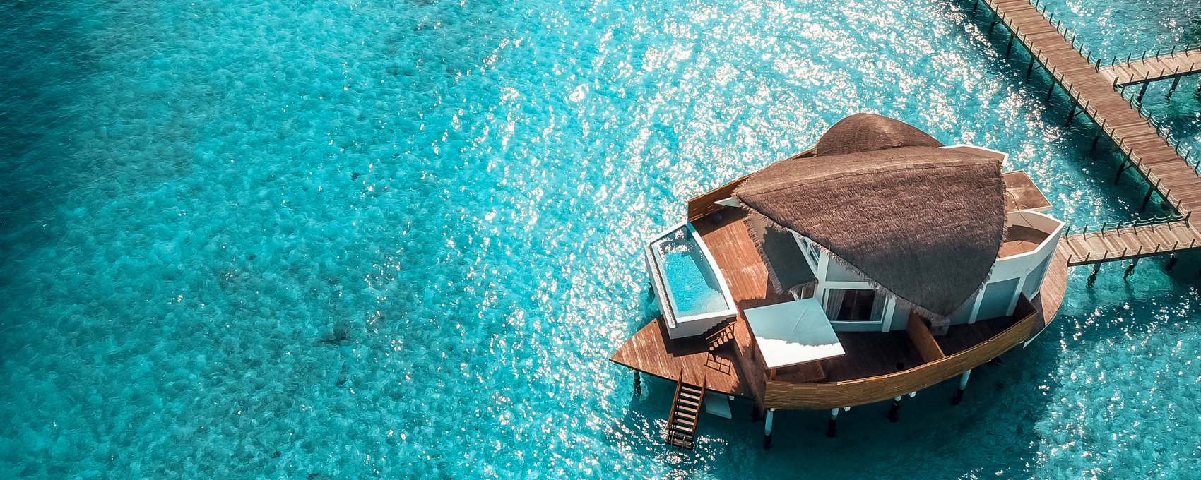Luxury Maldives water villas at sunset